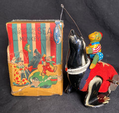Vintage TPS Japan Wind Up Seal and Monkey with Fish