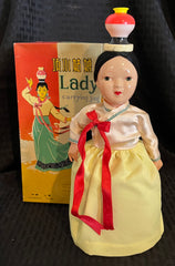 Vintage Battery Operated China ME401 Lady Carrying Jug
